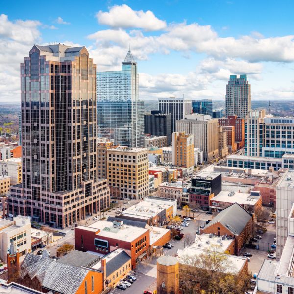 Aerial view of downtown Raleigh, NC skyline with high-rise buildings near Madison Laurel Oaks apartments
